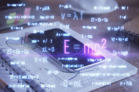 Double exposure of formula drawing and mobile phone background. Concept of educationの写真素材