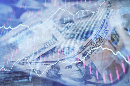 Double exposure of forex graph drawing over us dollars bill background. Concept of financial markets.の写真素材