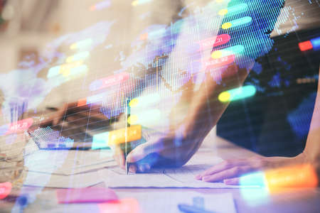 Double exposure of woman hands working on computer and data theme hologram drawing. Tech concept.