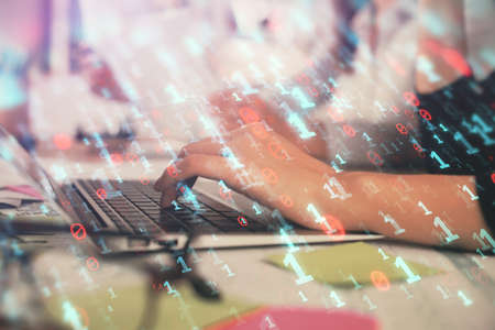 Multi exposure of woman hands working on computer and data theme hologram drawing. Tech concept.