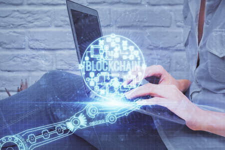 Double exposure of woman hands typing on computer and crypto market theme hologram drawing....