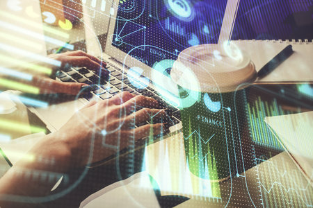 Double exposure of woman hands working on computer and data theme hologram drawing. Tech concept.