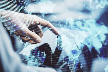 Double exposure of mans hands holding and using a phone and international business theme drawing.の写真素材