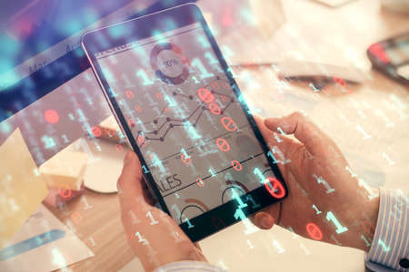 Multi exposure of mans hands holding and using a digital device and data theme drawing. Innovation concept.の写真素材