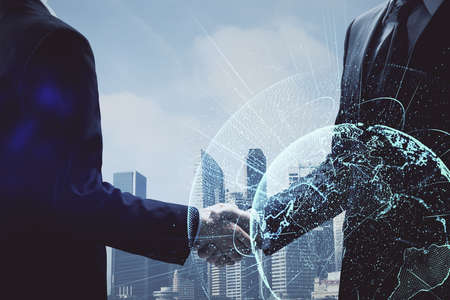 Double exposure of social network theme hologram and handshake of two men.
