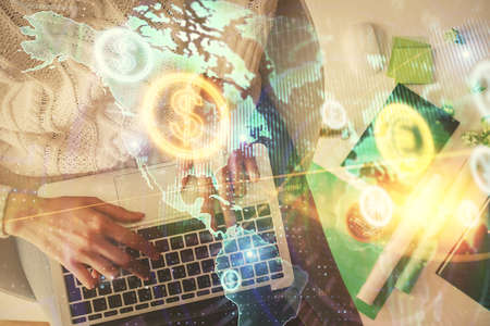 Multi exposure of woman hands working on computer and forex chart hologram drawing. Top View....