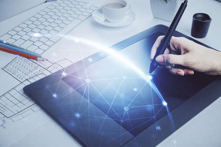 Double exposure of social network sketch hologram and woman holding and using a mobile device.の写真素材