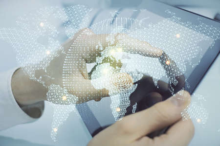 Double exposure of mans hands holding and using a phone and international business theme drawing.の写真素材