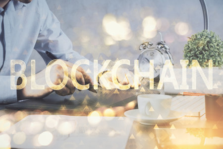 Double exposure of mans hands holding and using a phone and crypto currency blockchain theme drawing.の写真素材