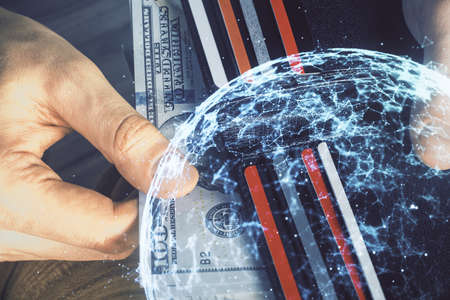 Multi exposure of social network theme drawing hologram and USA dollars bills and man hands.