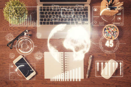 Stock market graph and top view computer on the table background. Multi exposure. Concept of financial education.の写真素材