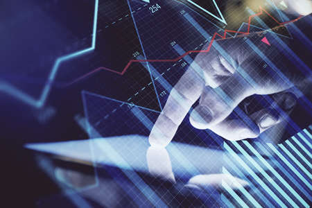 Double exposure of mans hands holding and using a digital device and forex graph drawing. Financial...