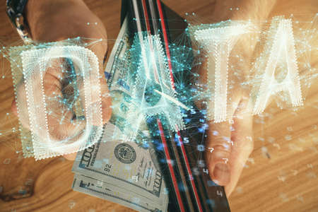 Double exposure of technology drawing hologram and us dollars bills and man hands. Data conceptの写真素材