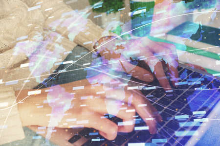 Double exposure of woman hands working on computer and data theme hologram drawing. Tech concept.
