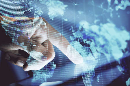 Double exposure of mans hands holding and using a phone and international business theme drawing.