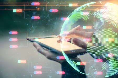 Double exposure of map sketch hologram and woman holding and using a mobile device.