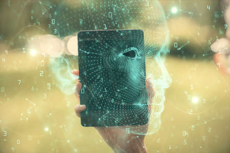 Double exposure of brain sketch hologram and woman holding and using a mobile device.の写真素材