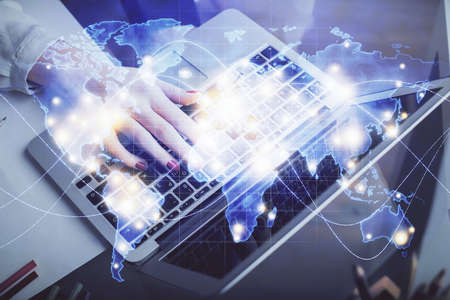 Multi exposure of woman hands typing on computer and business theme hologram drawing. Success...