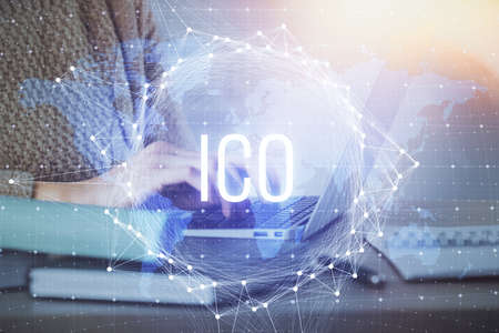 Double exposure of woman hands typing on computer and crypto market theme hologram drawing....