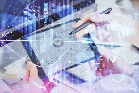 Double exposure of mans hands holding and using a phone and international business theme drawing.