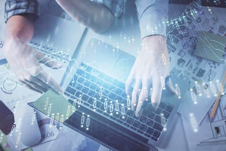 Double exposure of man and woman working together and forex graph hologram drawing. Financial...