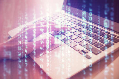 Double exposure of woman hands working on computer and data theme hologram drawing. Tech concept.