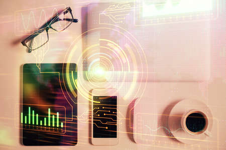 Double exposure of technology theme drawing over work table desktop. Top view. Global data analysis...