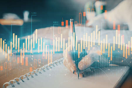 Double exposure of forex chart drawing over people taking notes background. Concept of financial analysisの写真素材