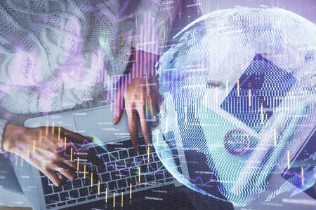 Multi exposure of woman hands working on computer and forex chart hologram drawing. Top View....