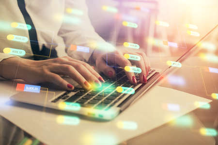 Multi exposure of woman hands working on computer and data theme hologram drawing. Tech concept.