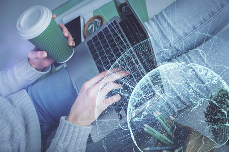 Double exposure of woman hands typing on computer and social network theme hologram drawing. People media concept.の写真素材