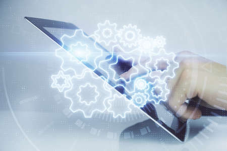 Double exposure of mans hands holding and using a phone and international business theme drawing.の写真素材