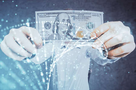Multi exposure of dna drawing hologram and USA dollars bills and man hands. Medical education concept.の写真素材