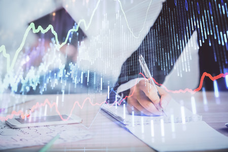 Double exposure of forex chart drawing over people taking notes background. Concept of financial analysisの写真素材