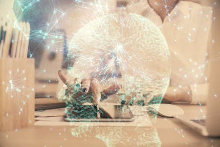 Double exposure of brain sketch hologram and woman holding and using a mobile device.