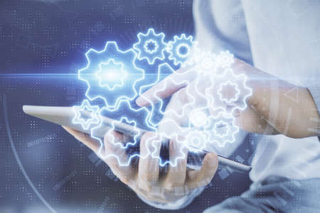 Double exposure of mans hands holding and using a phone and international business theme drawing.