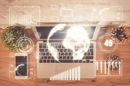 Multi exposure of financial chart drawing over table background with computer. Concept of research...