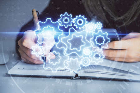 Multi exposure of woman hands typing on computer and business theme hologram drawing. Success...