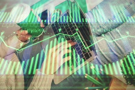Double exposure of woman hands working on computer and data theme hologram drawing. Tech concept.