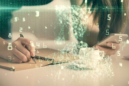 Double exposure of technology sketch hologram and woman holding and using a mobile device.の写真素材