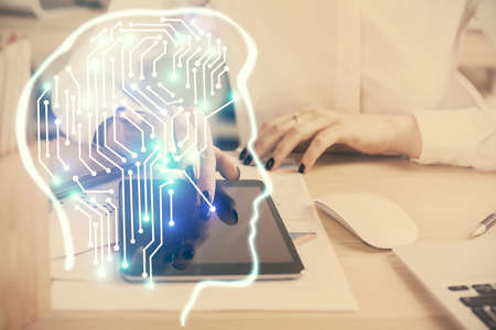 Double exposure of brain sketch hologram and woman holding and using a mobile device.