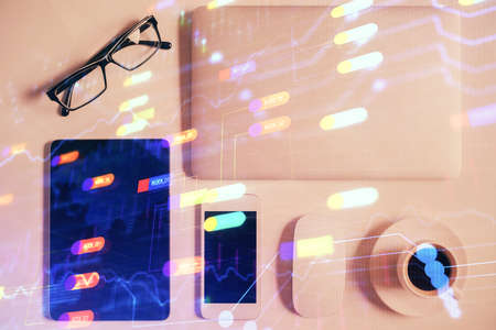 Double exposure of technology theme drawing over work table desktop. Top view. Global data analysis...