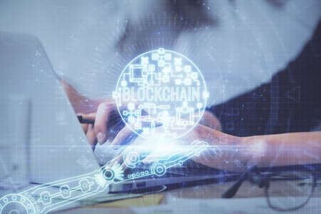 Double exposure of woman hands typing on computer and crypto market theme hologram drawing....