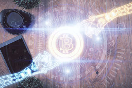 Double exposure of blockchain theme hologram over table with phone. Top view. Crypto technology...