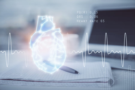Double exposure of heart drawing and desk with open notebook background. Concept of medical...