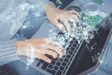 Double exposure of woman hands typing on computer and social network theme hologram drawing. People media concept.の写真素材