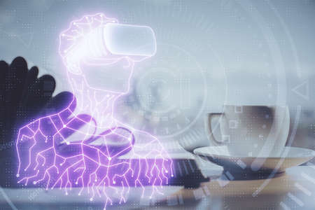 Double exposure of vr glasses drawing and desktop with coffee and items on table background. Concept...