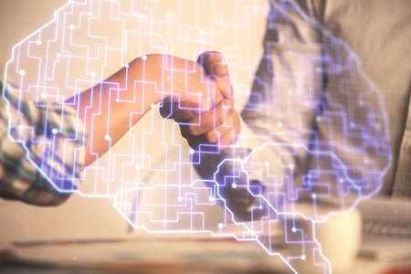 Double exposure of brain hologram and handshake of two men. Partnership in IT industry concept.