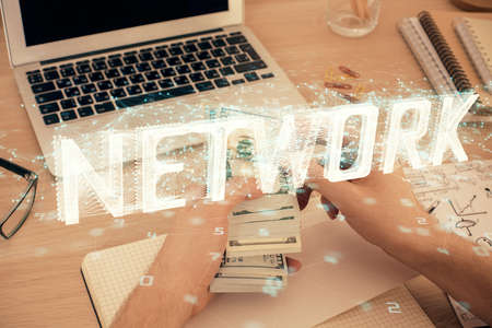 Multi exposure of technology drawing hologram and us dollars bills and man hands. Data conceptの写真素材