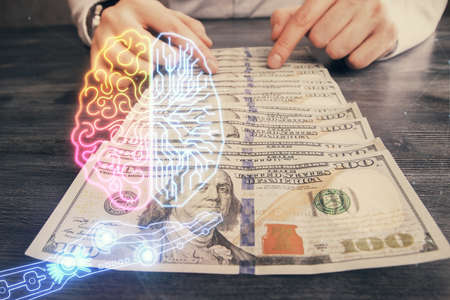 Multi exposure of brain drawing hologram and us dollars bills and man hands. Ai invest conceptの写真素材